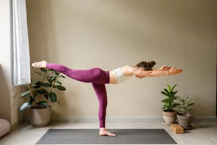 Woman doing Yoga exercise Lowestoft to help with toning the body. 