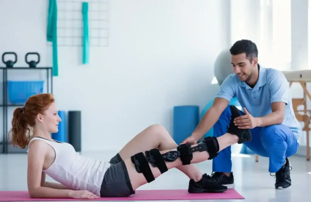 Woman having treatment to help muscle recovery Lowestoft after an injury