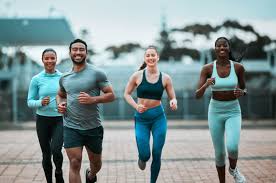 Sculpting Sleek Arms: The Essential Role of Cardio in Toning Without Bulking Up 3 image of people running to incorporate cardio Lowestoft exercise into their life to help tone arms and body.