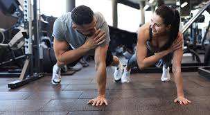 Image of man and woman doing Cardio Lowestoft to tone their arms. 